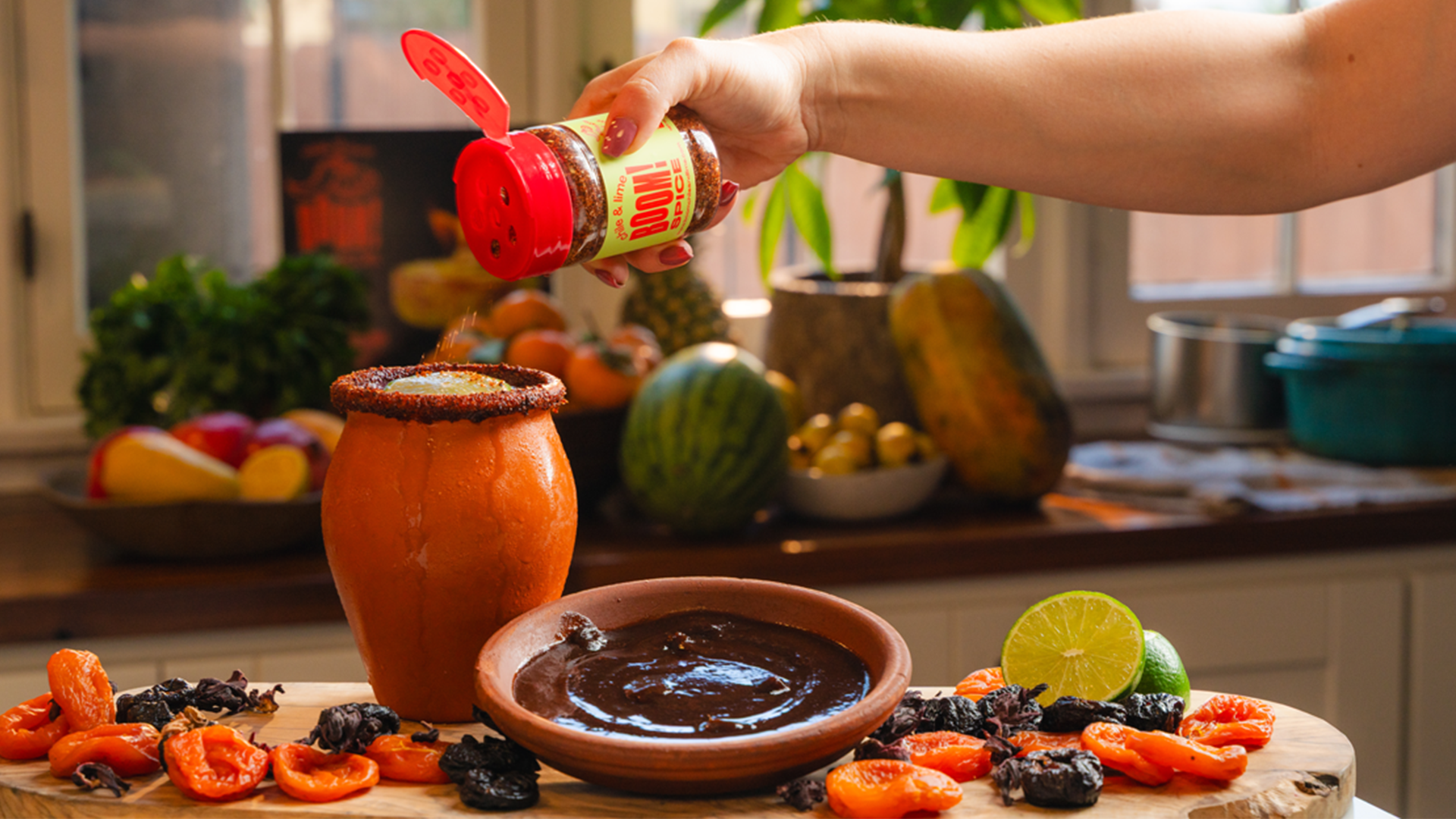 A person making sauce in a kitchen with spices